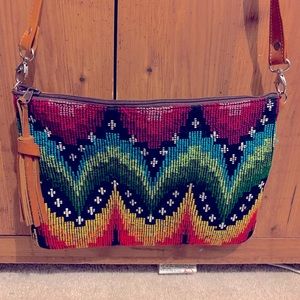 This huipil crossbody bag was made in Guatemala
